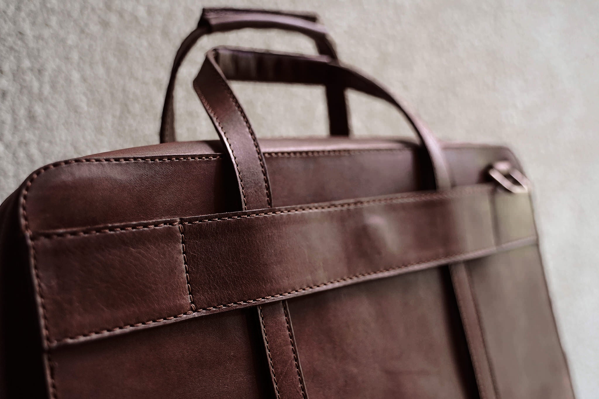 Full width back pocket underneath the luggage handle slot.